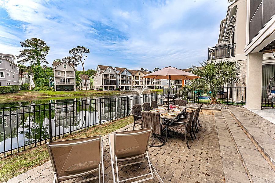 Outdoor dining table beside the lagoon