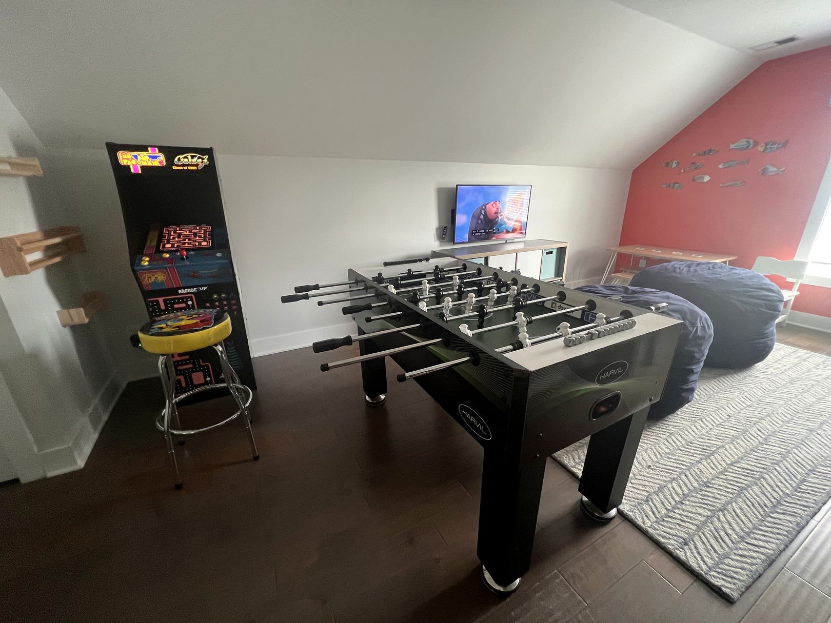 Kids' playroom at 122 Sandcastle Court with an arcade machine, foosball table, beanbags and bunk beds